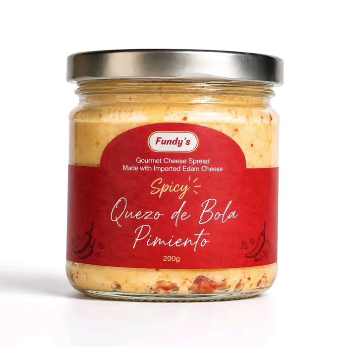 Jar of Fundy's Spicy Quezo de Bola Pimiento Spread with a red label, 200g gourmet cheese palaman